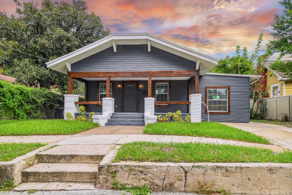 Baker Ave exterior transformation — charcoal bungalow at sunset