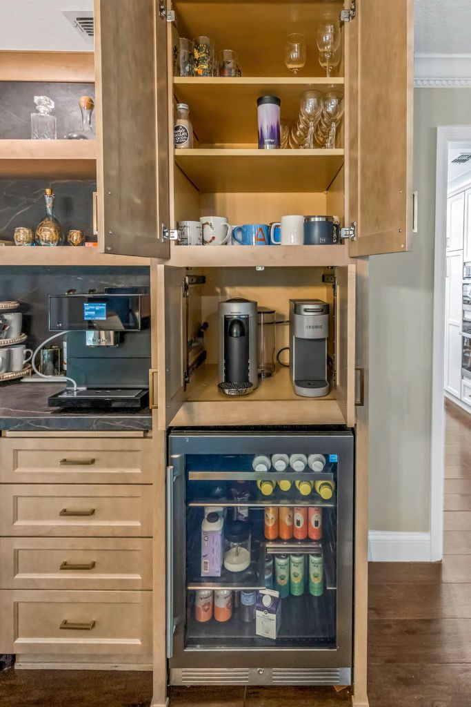 Open bar cabinet with coffee station and beverage fridge