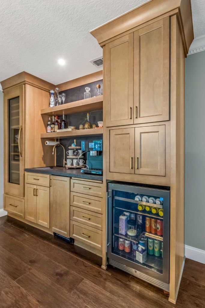 Custom bar cabinetry with beverage fridge by Davison Refined Design